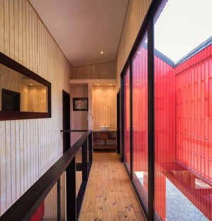 Felipe Assadi Arquitectos designs La Roja, a red house in the mountains of Chile
