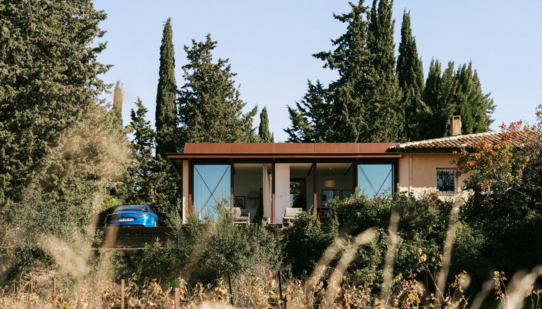 Mahos Architecture’s addition to a home in a vineyard 
