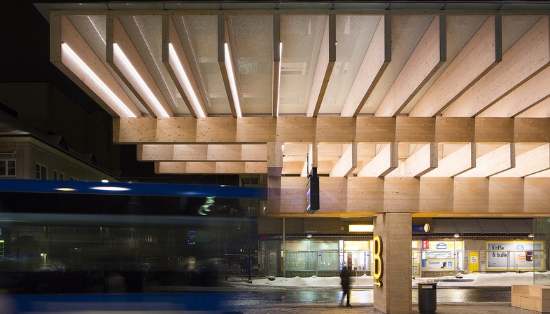 A structure made of concrete and laminated timber for a bus shelter in Umeå, Sweden.