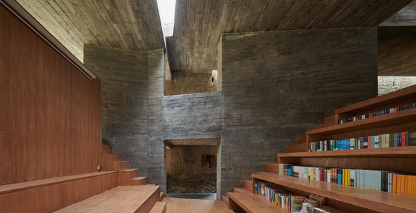 House renovated and transformed into a concrete and steel bookshop by TAO Architects
