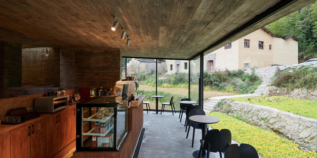 House renovated and transformed into a concrete and steel bookshop by TAO Architects
