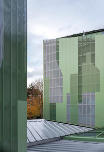 Prefabricated concrete renovation and addition with a perforated aluminium façade 

