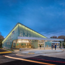 A translucent façade with neon lighting for Carrollton Library
